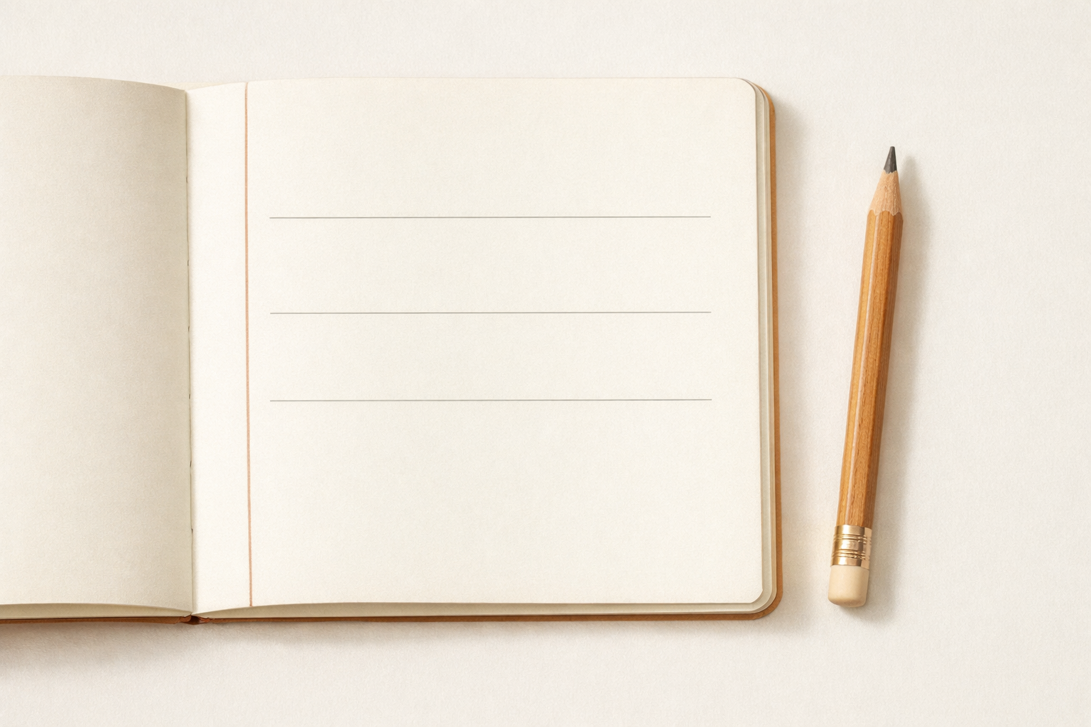 An open notebook displaying three blank lines with a pencil next to it.